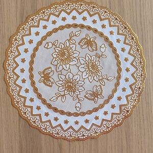 Gold floral design round placemat,